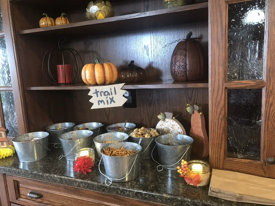 Trail mix bar in galvanized buckets with fall décor