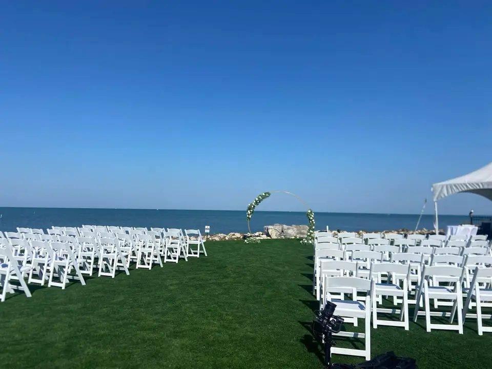 Lakeside wedding ceremony with floral hoop arch