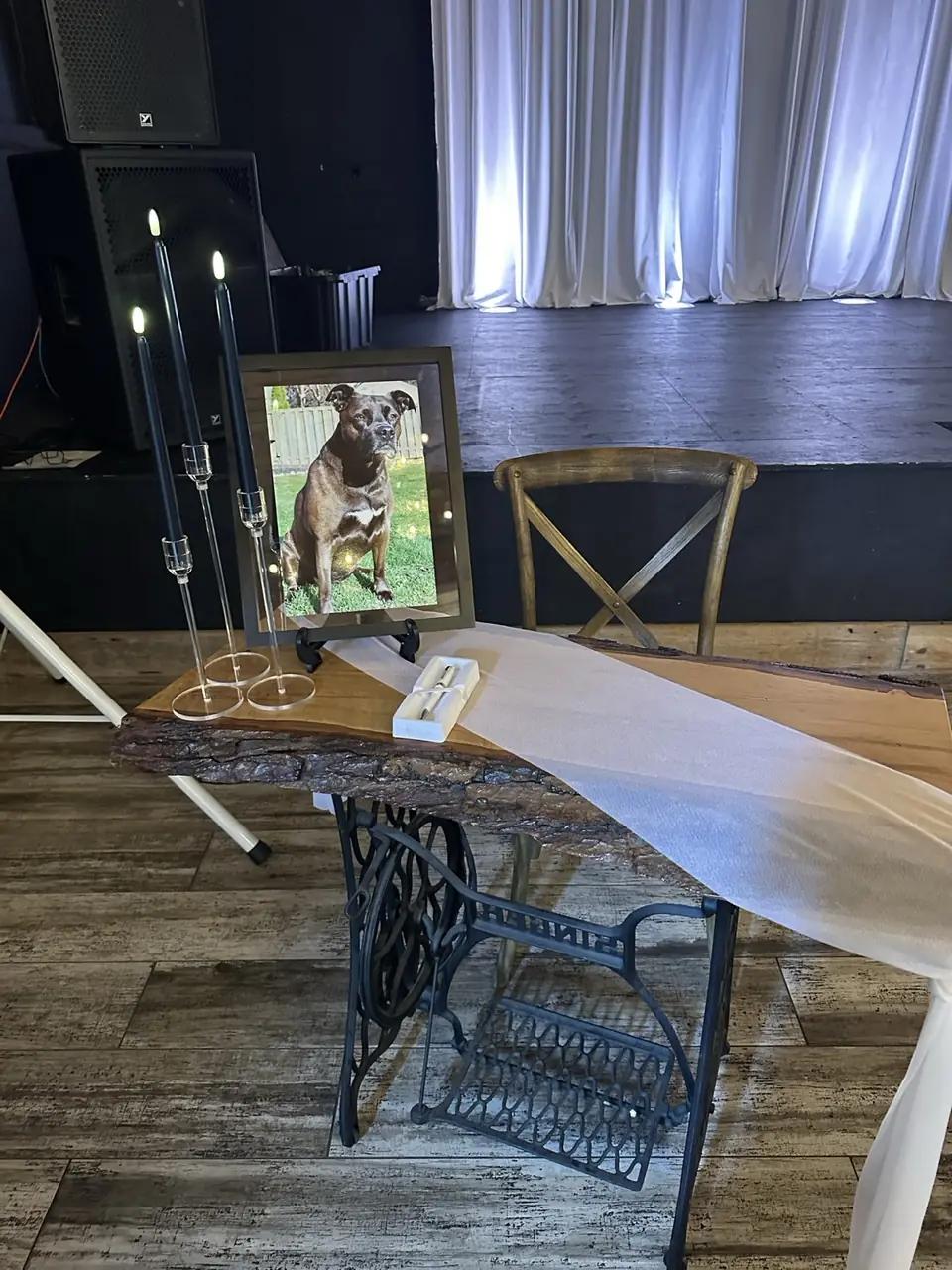 Memorial portrait of a dog with taper candles