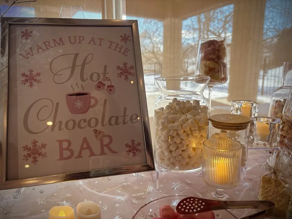 Warm up at the Hot Chocolate Bar sign with marshmallow jars
